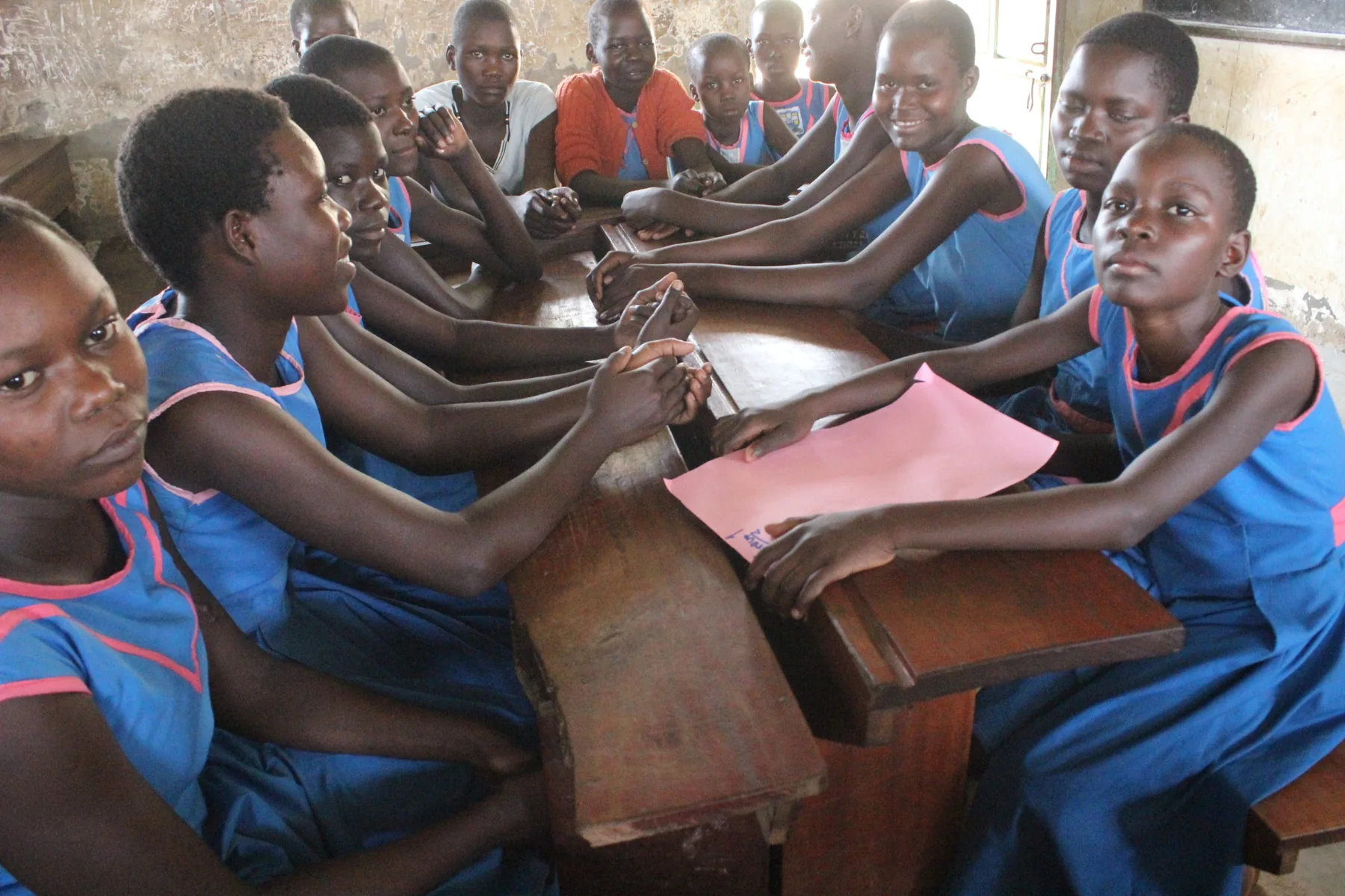 Schoolgirls participating in a classroom group learning session