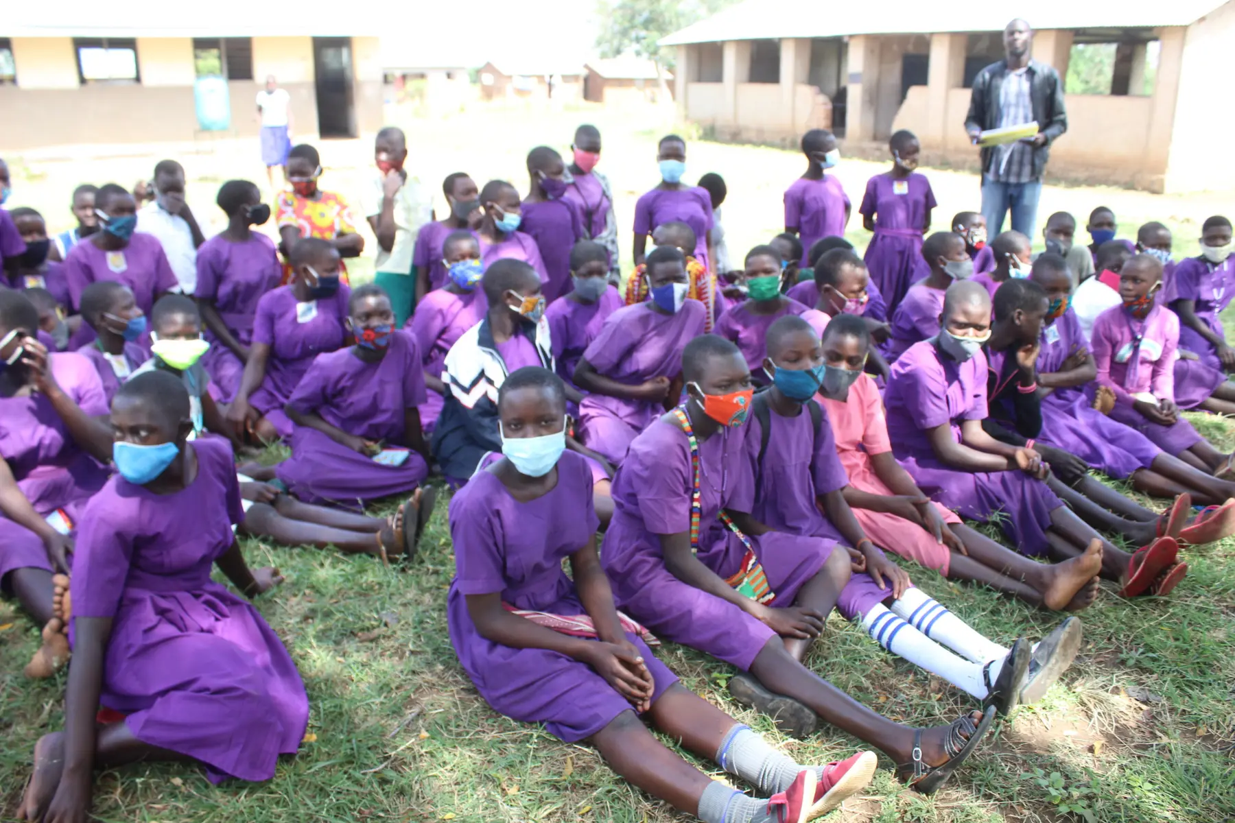 Girls gathered during a YWAFT community learning activity in Teso